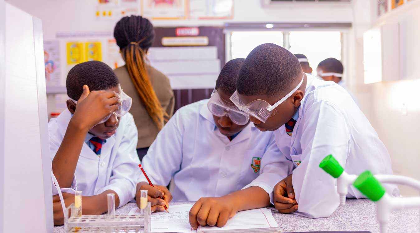 Court Hill College - Students in Science Lab experimenting